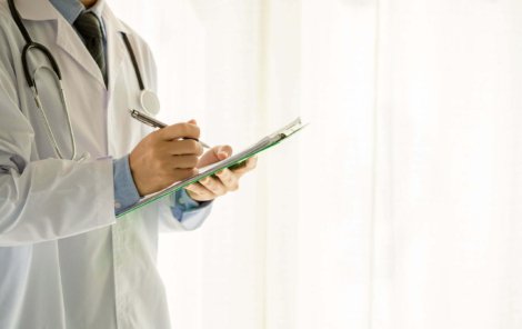 Medical physician doctor man over white background. Medicine and health care concept
