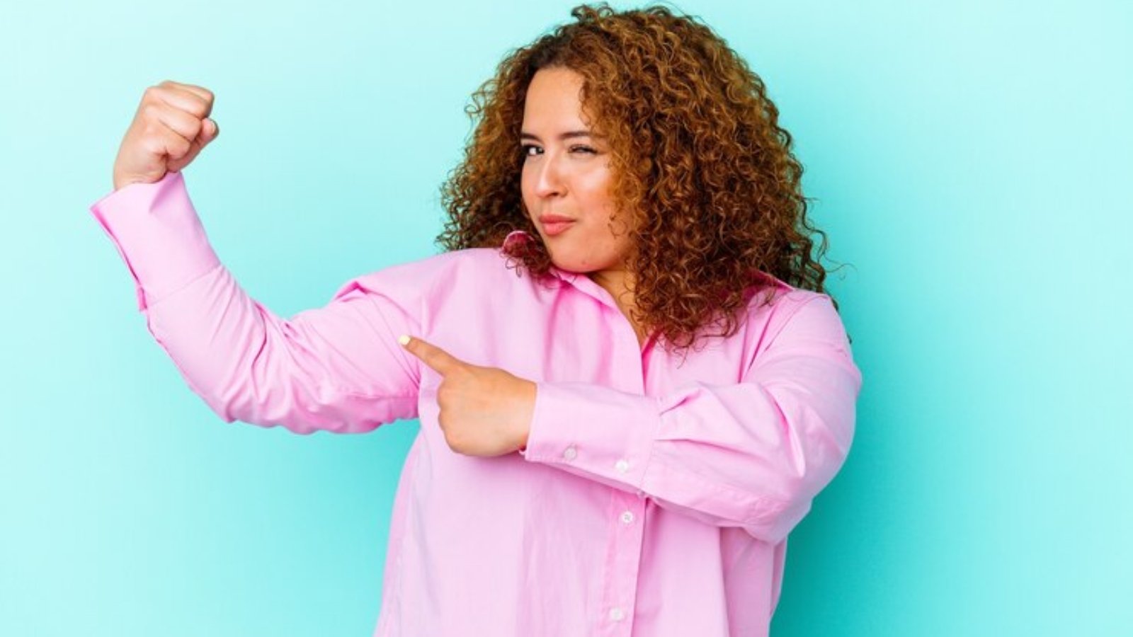 young-latin-curvy-woman-isolated-blue-background-showing-strength-gesture-with-arms-symbol-feminine-power_1187-133268