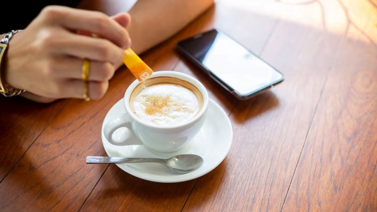 male-hand-puting-sugar-coffee-cup_1150-14260-jpg-740×493-