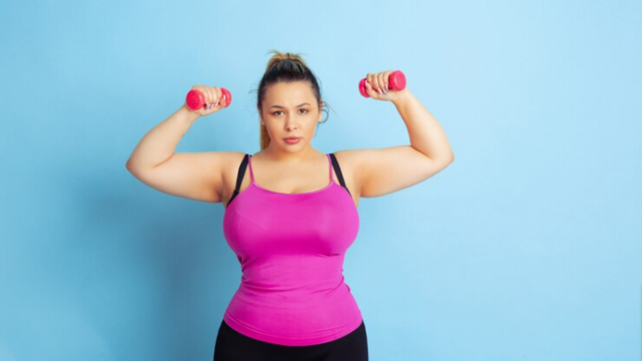 young-caucasian-plus-size-female-model-s-training-on-blue-background