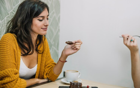 woman-eating-dessert-with-friend
