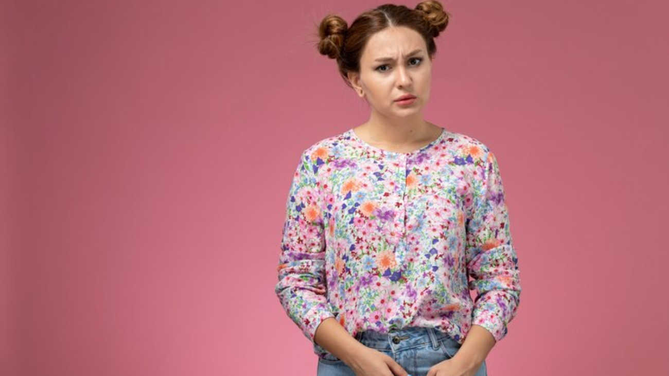 front-view-young-female-flower-designed-shirt-blue-jeans-just-posing-pink-background_140725-27408-jpg-740×493-