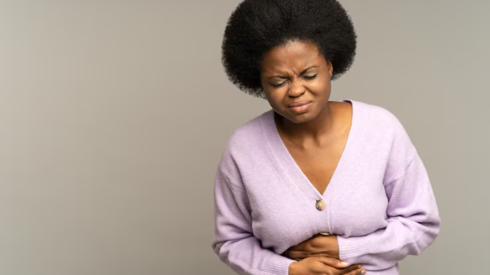 sick-african-woman-suffer-acute-period-pain-ache-stomach-pressing-hands-abdominal-belly_165285-3838-jpg-740×493-