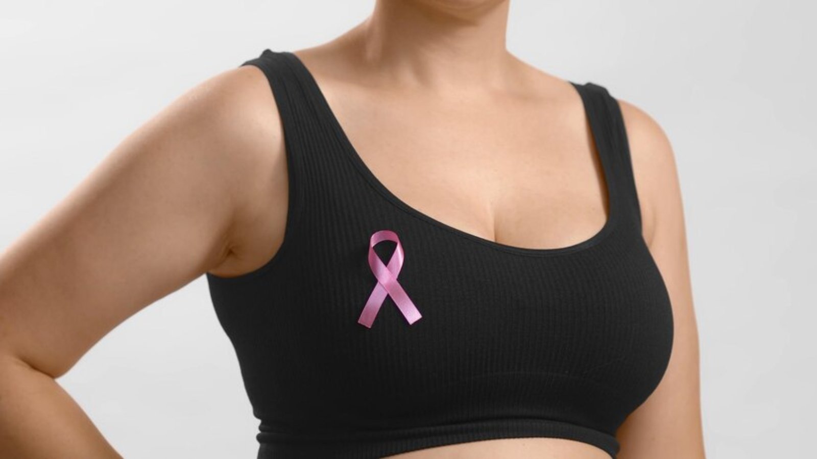 young-european-lady-black-top-standing-with-ribbon-sign-her-chest-support-pink-october-females-combating-breast-cancer-anonymous-studio-shot-high-quality-photo-white-background_633478-510