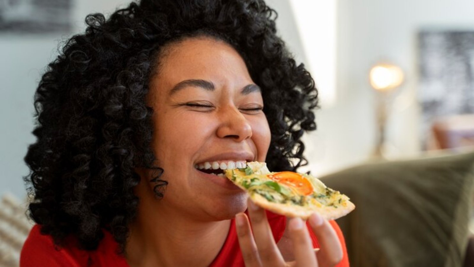 medium-shot-woman-with-delicious-pizza_23-2150307066