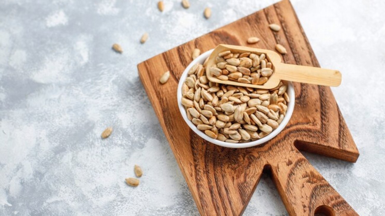 homemade-sunflower-halva-cutting-board-with-sunflower-seeds_114579-4679