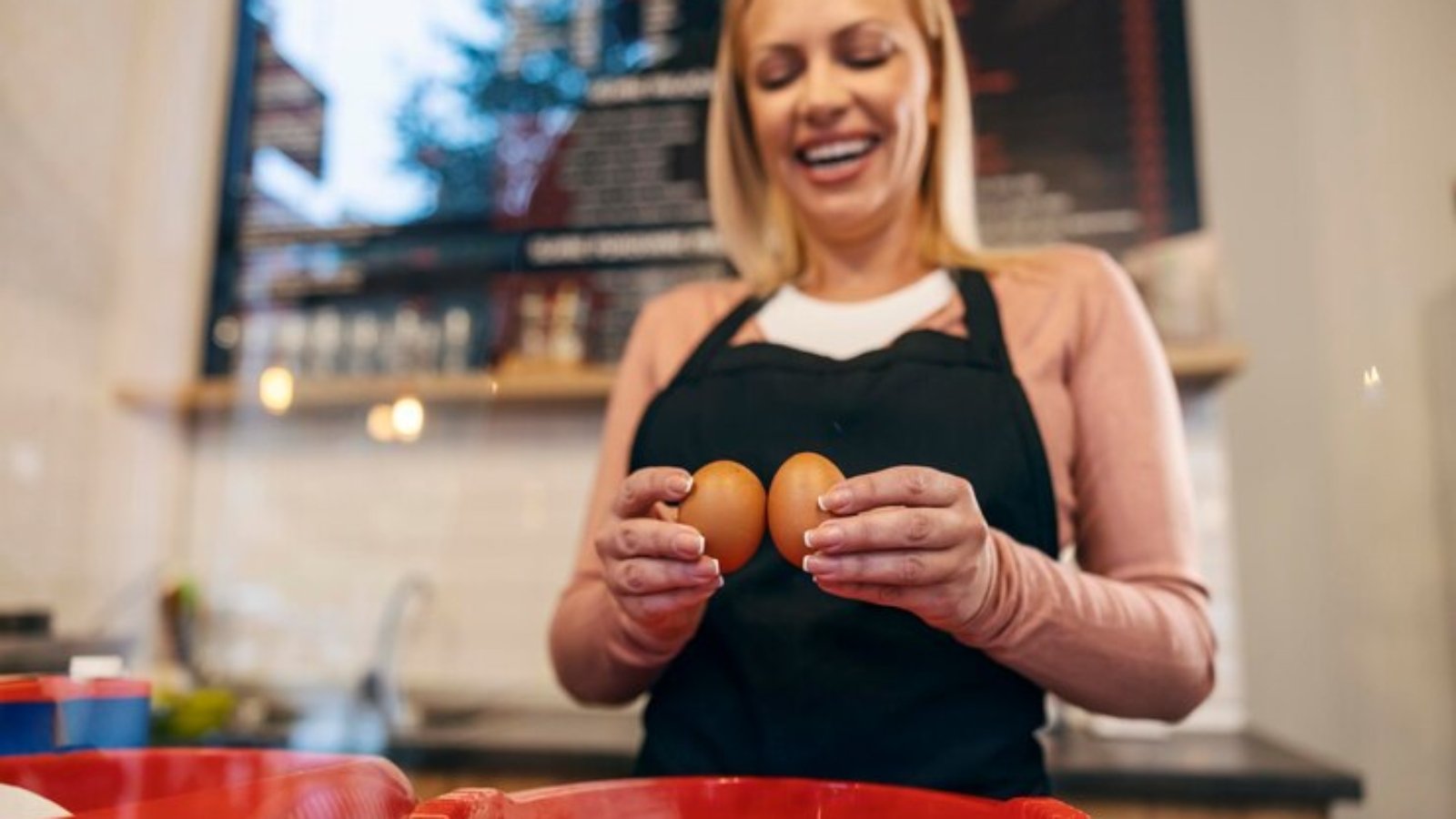 close-up-pancake-house-worker-breaking-eggs-make-crepes-mix_232070-13433