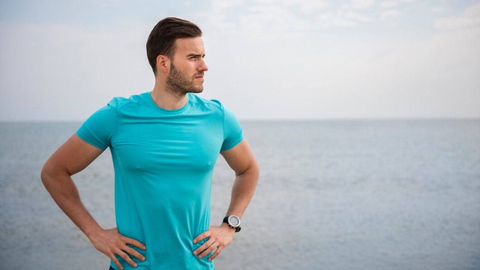 close-up-young-fit-person-jogging-by-sea_329181-16755