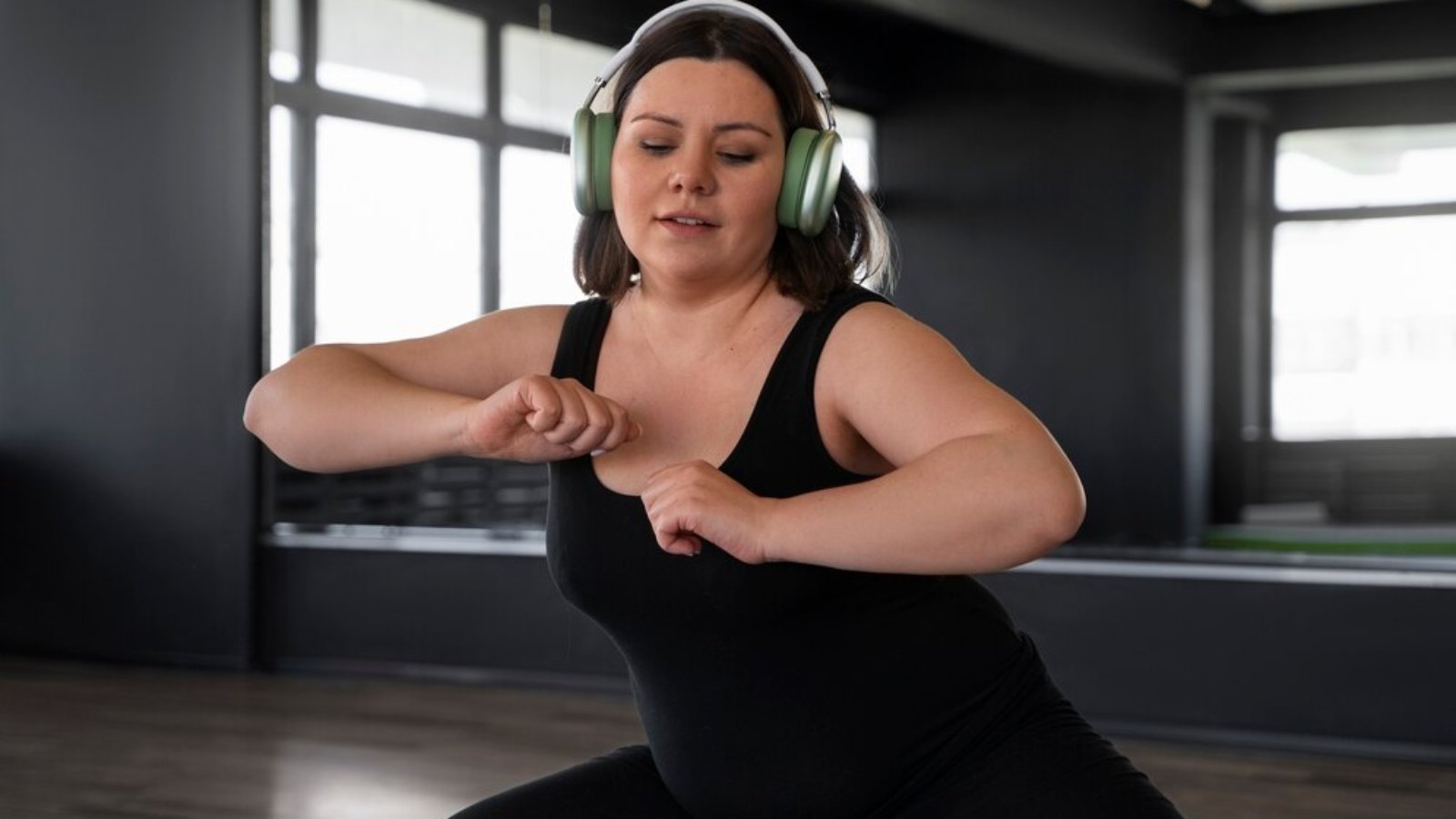 medium-shot-woman-dancing-studio_23-2150621019