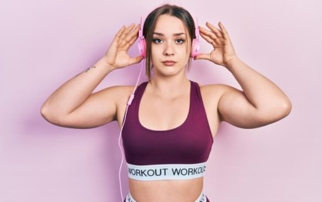 young-hispanic-girl-wearing-gym-clothes-using-headphones-relaxed-with-serious-expression-face-simple-natural-looking-camera_839833-25195