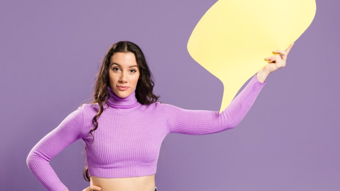 woman-holding-speech-bubble-front-view_23-2148405159