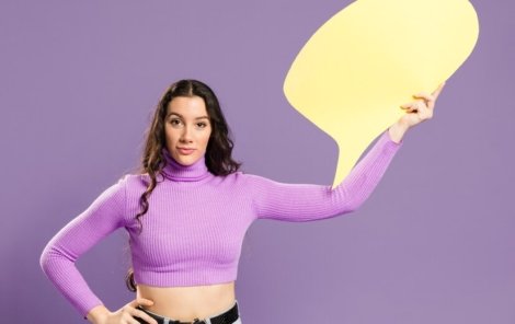 woman-holding-speech-bubble-front-view_23-2148405159