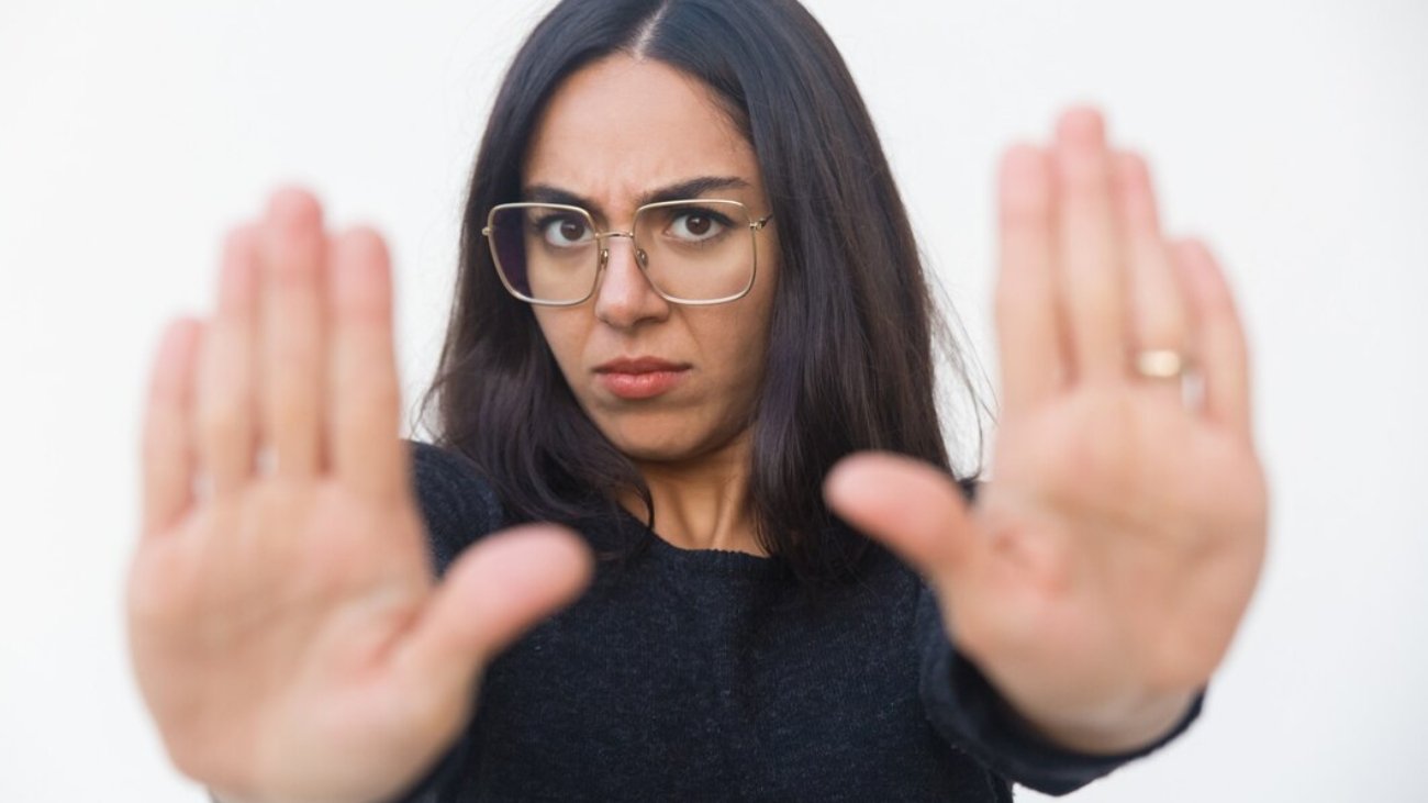scared-upset-woman-making-stop-gesture_74855-3672