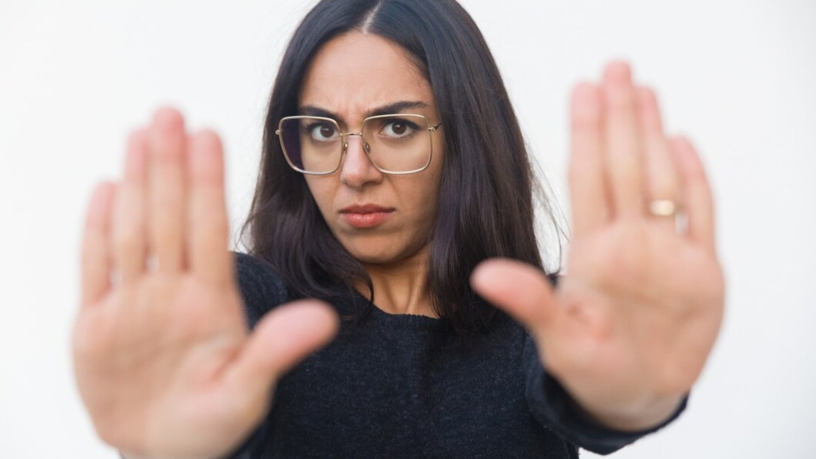 scared-upset-woman-making-stop-gesture_74855-3672
